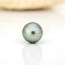 Load image into Gallery viewer, Single pearl on a reflective surface with a blurred background