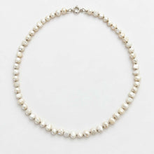 Load image into Gallery viewer, A freshwater pearl necklace with irregular, organic-shaped white pearls and a silver clasp, displayed on a clean white background.