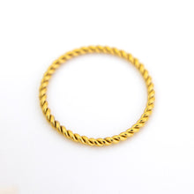 Load image into Gallery viewer, Gold ring with twisted design on a white background