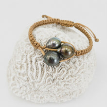 Load image into Gallery viewer, Pearl trio bracelet with coral background
