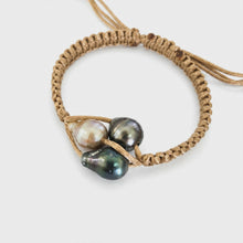 Load image into Gallery viewer, Pearl trio bracelet with coral background
