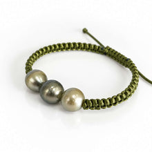 Load image into Gallery viewer, An olive green macrame bracelet featuring three large, round, dark gray pearls, displayed on a clean white background.
