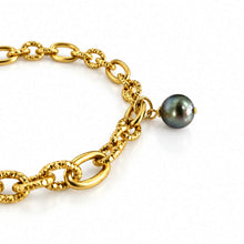 Load image into Gallery viewer, A close-up of a gold chain bracelet featuring a single dark gray pearl bead, set against a clean white background.
