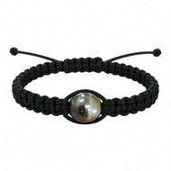 A black macrame bracelet featuring a central pearl, displayed on a clean white background.