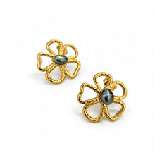 Load image into Gallery viewer, A pair of gold flower-shaped stud earrings with a dark gray oval pearl set in the center, shown on a clean white background.

