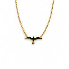 Load image into Gallery viewer, A gold chain necklace featuring a small flying bird pendant with black enamel fill, shown against a plain white background.
