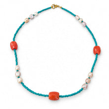 Load image into Gallery viewer, A beaded necklace featuring turquoise blue cord, large polished coral-red oval beads, and small white freshwater pearls, displayed on a clean white background.
