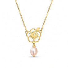Load image into Gallery viewer, A gold chain necklace featuring a cutout flower pendant with a hibiscus flower design and a dangling light pink freshwater pearl, shown on a plain white background.

