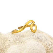 Load image into Gallery viewer, Gold wave-shaped ring on a white background
