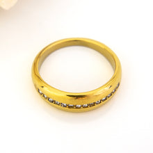 Load image into Gallery viewer, Gold ring with embedded diamonds on a white background
